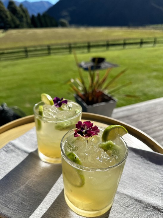 Lime cocktails on a table outdoors.